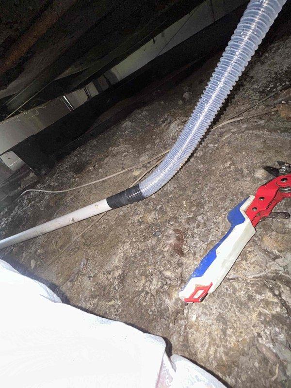 Responded to callback for incomplete condensate drain line installation in crawl space. Successfully located and connected the flexible condensate line to proper drainage point, ensuring proper pitch and secure connections throughout the run. Verified system operation with no leaks detected and condensate flowing freely to designated drain location.