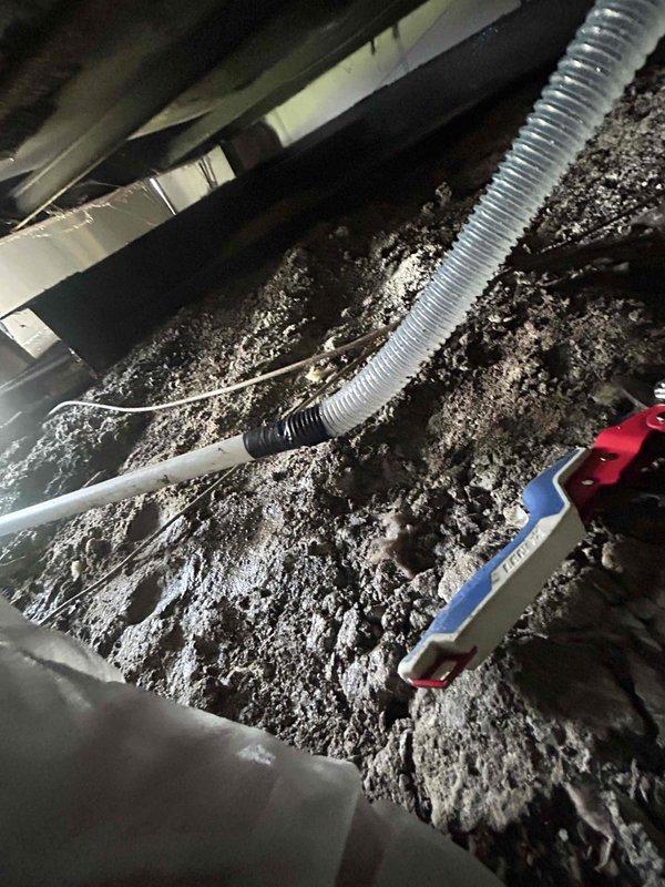 Responded to callback for incomplete condensate drain line installation in crawl space. Successfully located and connected the flexible condensate line to proper drainage point, ensuring proper pitch and secure connections throughout the run. Verified system operation with no leaks detected and condensate flowing freely to designated drain location.
