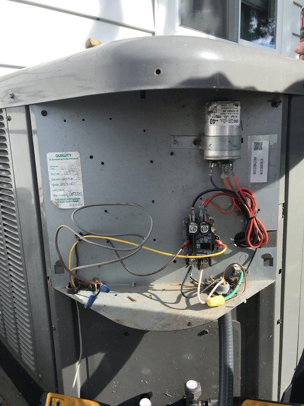 # HVAC Service Report

Responded to no cooling complaint on residential air conditioning unit. Upon inspection, found significant accumulation of organic debris including dried leaves, twigs, and plant matter inside the unit's interior compartment. Debris had collected on the bottom shelf and throughout the housing, restricting airflow and potentially interfering with electrical components. 

Removed access panel and cleared all organic debris from interior compartment. Inspected electrical components including capacitor, contactor, and associated wiring connections. All electrical connections appeared secure with no visible signs of damage from debris accumulation. Verified proper operation of capacitor and contactor. Cleaned interior surfaces and ensured all components were free from obstruction.

Reinstalled access panel and tested system operation. Unit restored to proper cooling function. Advised ongoing maintenance to prevent future debris accumulation.