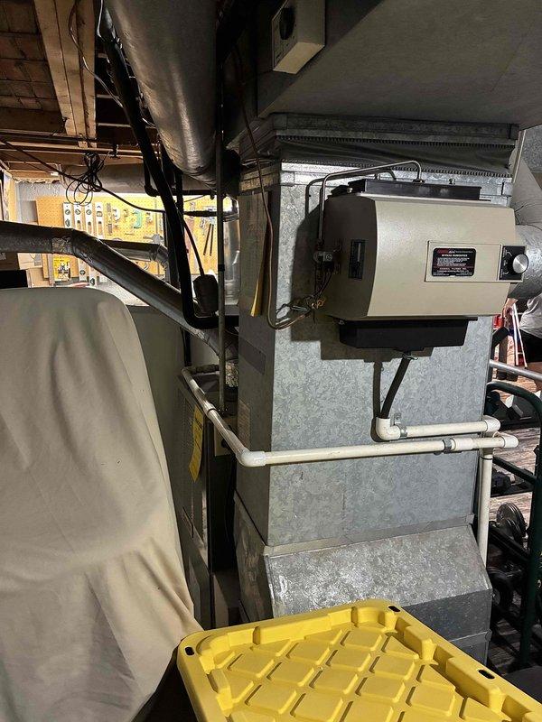 Provided comprehensive estimate for complete HVAC system replacement of 23-year-old air conditioning unit and natural gas furnace located in basement. Evaluated existing equipment including humidifier, ductwork, and PRO1 thermostat to determine replacement specifications and system compatibility. Documented current system configuration and discussed options for new high-efficiency equipment installation.