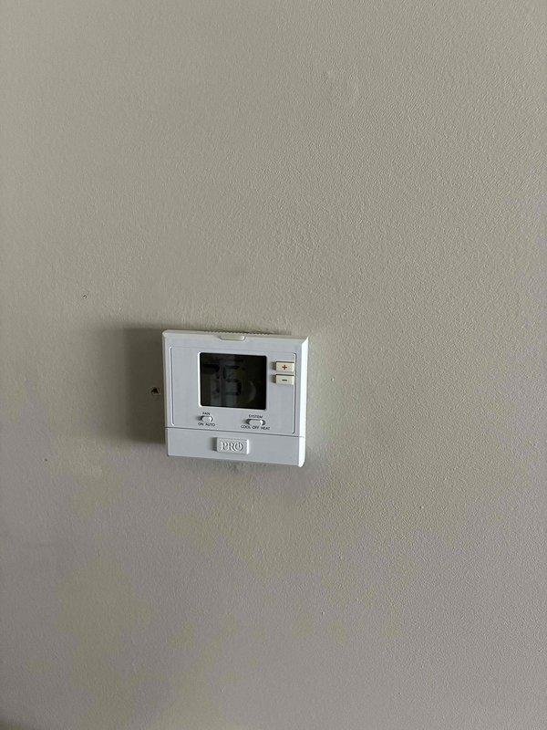 Provided comprehensive estimate for complete HVAC system replacement of 23-year-old air conditioning unit and natural gas furnace located in basement. Evaluated existing equipment including humidifier, ductwork, and PRO1 thermostat to determine replacement specifications and system compatibility. Documented current system configuration and discussed options for new high-efficiency equipment installation.