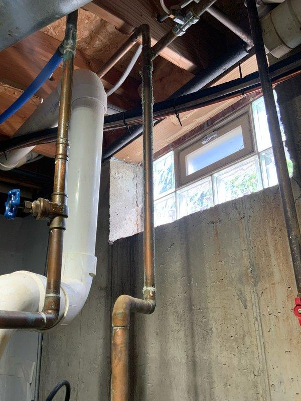 Responded to emergency service call for non-functioning water heater at residential property. Upon arrival, assessed existing A.O. Smith tanked water heater system in basement utility area and determined unit had failed beyond economical repair. Completed full water heater replacement, installing new unit with proper venting through existing PVC flue system. Reconnected all copper supply and distribution lines, installed new shut-off valves, and verified proper operation of recirculation pump mounted on top of tank. Tested temperature and pressure relief valve, confirmed adequate drainage provisions, and ensured all connections were secure and leak-free. System restored to full operational status with hot water service confirmed throughout residence.