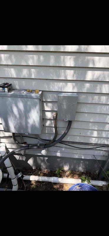 Successfully completed installation of a 2-ton air conditioning system with matching evaporator coil in rear location. Installed outdoor condensing unit on concrete pad with proper refrigerant line connections, electrical disconnect box with weather-resistant components, and PVC condensate drainage system. All copper refrigerant lines were properly insulated with foam wrapping, electrical connections were secured with appropriate conduit, and brass valve fittings were installed for system serviceability. Unit was fully reconnected, tested for proper operation, and system commissioned per manufacturer specifications.