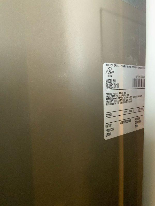 Responded to no cooling complaint on Goodman model FC4C60A1H heat pump system. Upon arrival, performed visual inspection and diagnostic assessment of the unit. Documented equipment nameplate information and current system condition through photographic records for service documentation purposes. Unit was confirmed to be under 10 years old based on serial number verification.