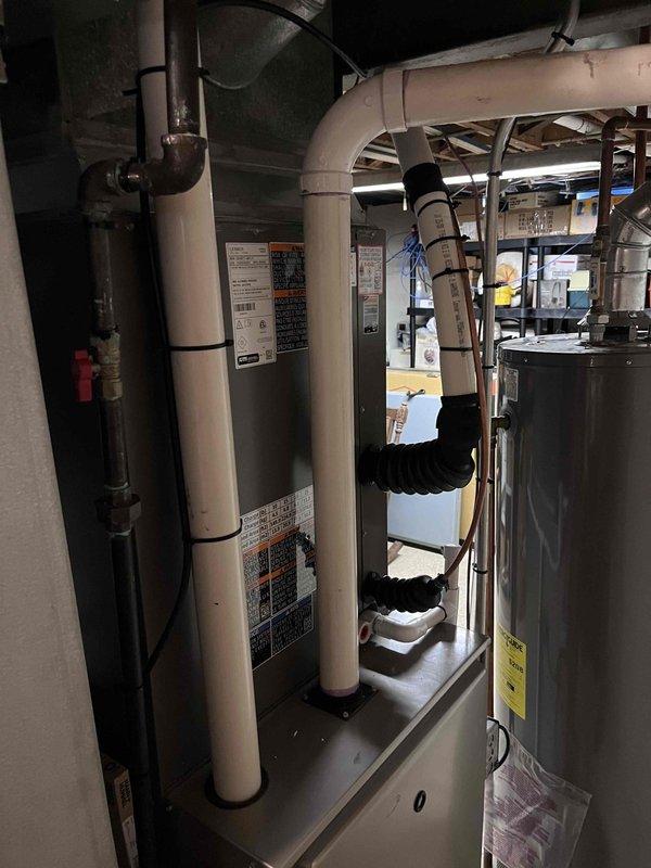 Completed installation of a 3-ton air conditioning system with matching evaporator coil on the right side of the property. Performed all mechanical and electrical connections, reconnected system components, and verified thermostat operation displaying 87°F at time of completion. All equipment installed per manufacturer specifications with proper labeling and secured ductwork connections in mechanical room.