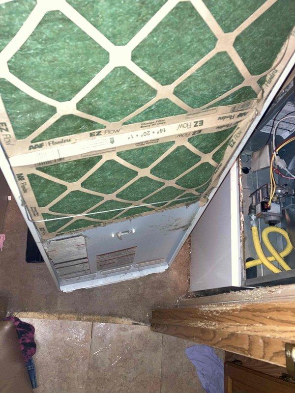 Completed preventive maintenance tune-up on residential HVAC system. Inspected indoor air handler unit and replaced 20x25x1 EZ Flow air filter, checked electrical connections and control board functionality. Serviced outdoor condensing unit, cleared vegetation growth from around base and perimeter, verified proper airflow through condenser coils and confirmed fan operation.
