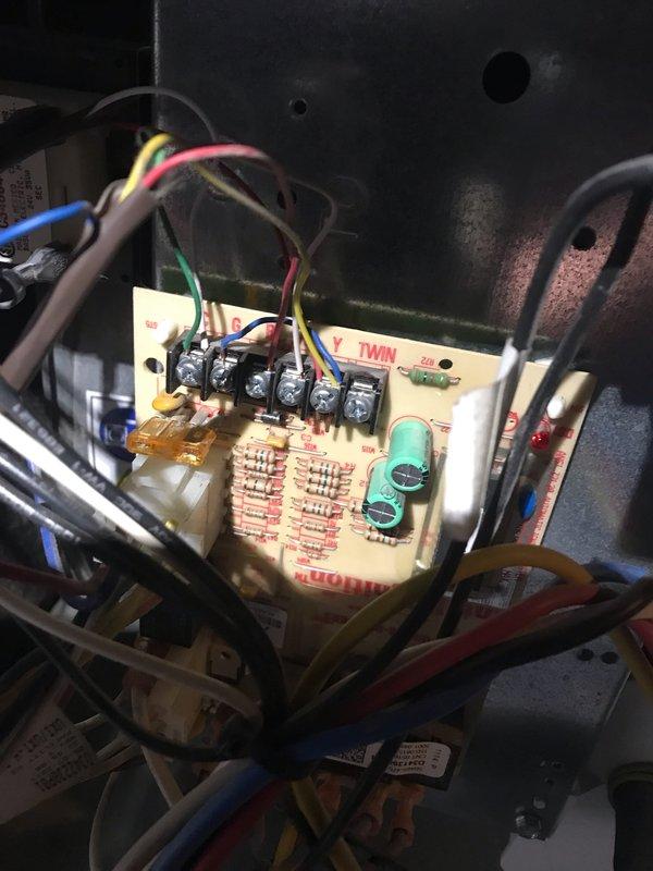 Responded to no-cool complaint on 20-year-old central air conditioning system with reported weak airflow and suspected refrigerant loss or compressor failure. Upon inspection, accessed control board and electrical components to diagnose system operation. Evaluated blower motor performance, checked compressor functionality, and assessed overall system condition. Documented equipment age and operational status with photos of control panel assembly and unit identification for service records.