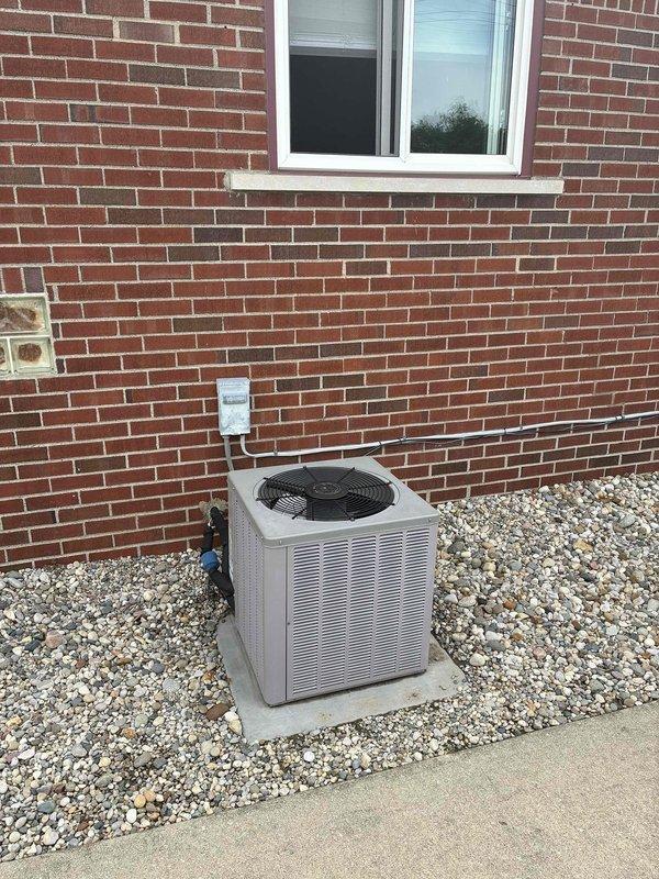 Provided estimate for complete HVAC system replacement including both air conditioning unit and natural gas furnace located in basement. Current 10+ year old system experiencing intermittent fan shutdown on AC condenser unit. Assessed existing GMC furnace showing rust staining on lower panel and outdoor condenser unit mounted on concrete pad at rear exterior. Quoted replacement of both heating and cooling components to address equipment age and current operational issues with AC fan cycling.