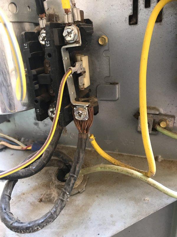 Responded to no cooling complaint on residential air conditioning system. Upon inspection, found heavily corroded evaporator coil with extensive oxidation and deterioration affecting heat transfer efficiency, causing unit to blow warm air. Contactor assembly showed signs of age but remained operational. Documented coil condition and advised replacement due to severity of corrosion compromising system performance.