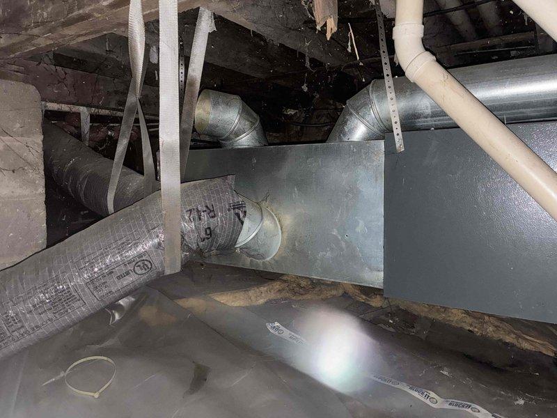 Completed comprehensive estimate for complete HVAC system replacement at residential property. Assessed existing attic-mounted air handler unit and associated ductwork infrastructure to determine replacement specifications. Documented current system configuration including air handler placement in confined attic space, existing flexible and rigid ductwork routing, condensate drain line installation, and support bracket positioning. Photographed equipment nameplate data, unit condition, and surrounding mechanical space to provide accurate replacement sizing and equipment selection. Revised previous estimate based on updated requirements and prepared financing options for customer consideration. System evaluation confirmed need for new equipment installation with proper ductwork integration and code-compliant installation in existing attic mechanical space.