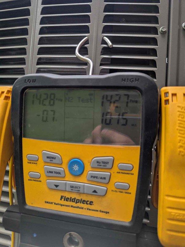 Completed full HVAC system installation including new air conditioning unit, evaporator coil, and furnace in residential basement location. Installed equipment on proper base pad with all required electrical connections, condensate drain lines using white PVC piping, and flexible ductwork. Verified system operation using calibrated digital testing instruments, confirming proper temperature differential and airflow parameters across the coil. All components tested and operational upon completion, with system commissioned and ready for service.