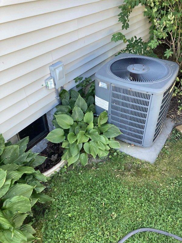 Completed Club AC10-2 preventive maintenance agreement visit on residential air conditioning system. Performed comprehensive inspection of outdoor condenser unit, including electrical diagnostics with multimeter showing 39.58 reading at heat exchanger coil, verified proper voltage levels, and confirmed system operational parameters within manufacturer specifications.