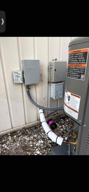 Completed full HVAC system installation including 70,000 BTU gas furnace, 2.5 ton air conditioning unit with rear discharge configuration, whole-house humidifier, and hot water heater reconnection. Installed all necessary PVC condensate drainage lines with proper pitch and connections, mounted outdoor condenser unit on gravel pad, and established electrical service with disconnect box and control panel using appropriate conduit routing. Secured all indoor components including furnace, humidifier assembly, and associated plumbing connections to wall with proper mounting brackets. Verified all electrical connections, tested system operation, and ensured compliance with manufacturer specifications and local code requirements. System fully operational upon completion.