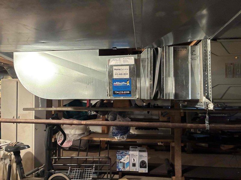 Conducted on-site assessment of existing residential HVAC system located in basement utility area. Evaluated current air handler unit with attached ductwork and inspected overall system configuration including associated mechanical components. Documented equipment condition and spatial layout through photographic documentation to support air conditioning replacement estimate. Provided comprehensive quote for AC system replacement based on observed installation requirements and existing infrastructure.