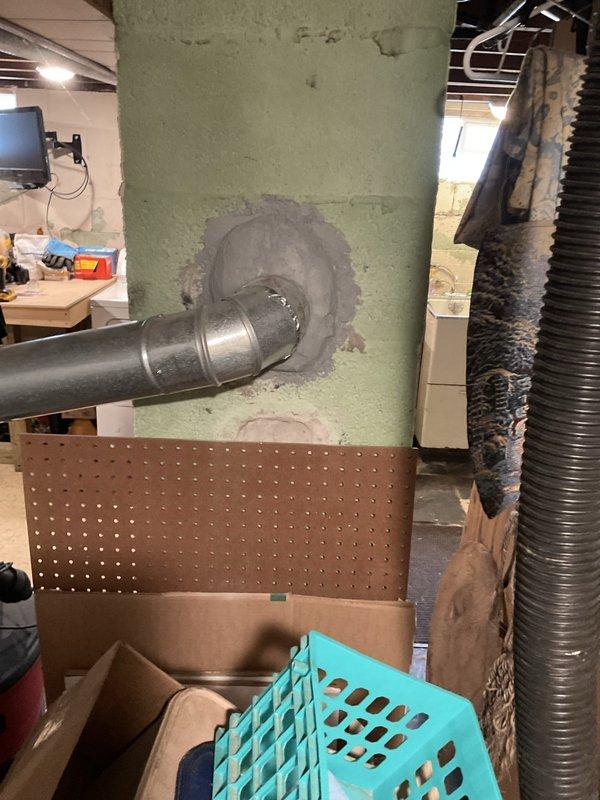 Provided estimate for replacement of non-functional 18-year-old standard water heater in single-family home basement. Assessed existing Whirlpool unit with natural draft venting configuration and documented current installation including copper supply connections, overhead piping, and vertical vent stack. Evaluated basement utility space conditions and confirmed requirements for standard tank-type water heater replacement.