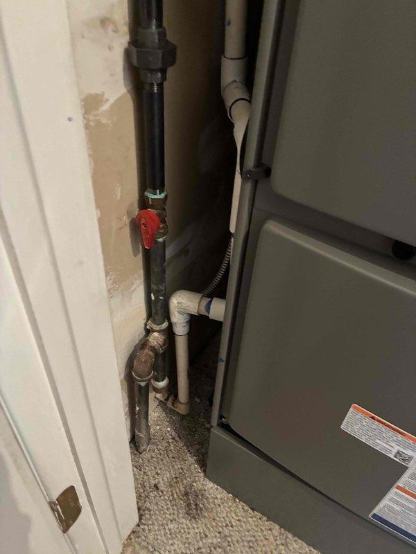 Completed full HVAC system installation including mechanical and electrical work. Installed 110,000 BTU furnace and 4-ton air conditioning unit in rear utility location. Configured condensate drainage system with PVC piping and connected leak detection system. Ran black flexible conduit for electrical connections and installed red-handled shut-off valve on supply lines. Reconnected all plumbing components including copper fittings and verified proper airflow and ventilation. System tested and operational upon completion.