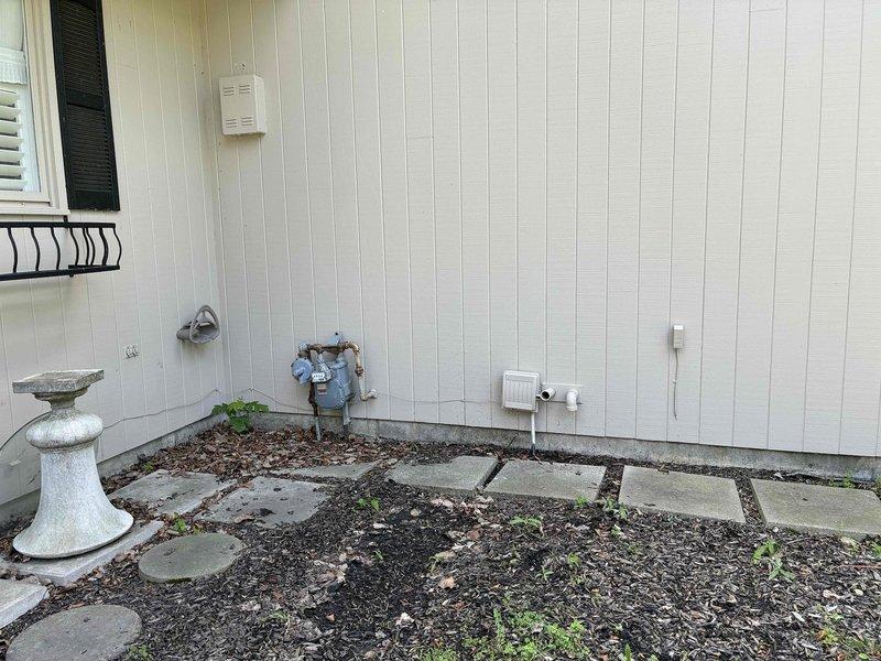 Conducted on-site evaluation of two residential air conditioning systems requiring replacement. First unit diagnosed with low refrigerant charge and determined economically unfeasible for repair due to age and condition of components. Second unit operational but running inefficiently with inadequate cooling performance. Inspected attic-mounted air handler, ductwork, and insulation conditions. Assessed exterior condenser units and electrical connections. Documented equipment specifications and existing system configuration. Provided comprehensive replacement estimate for both HVAC systems. Photographed attic mechanical components and exterior utility connections for documentation purposes.