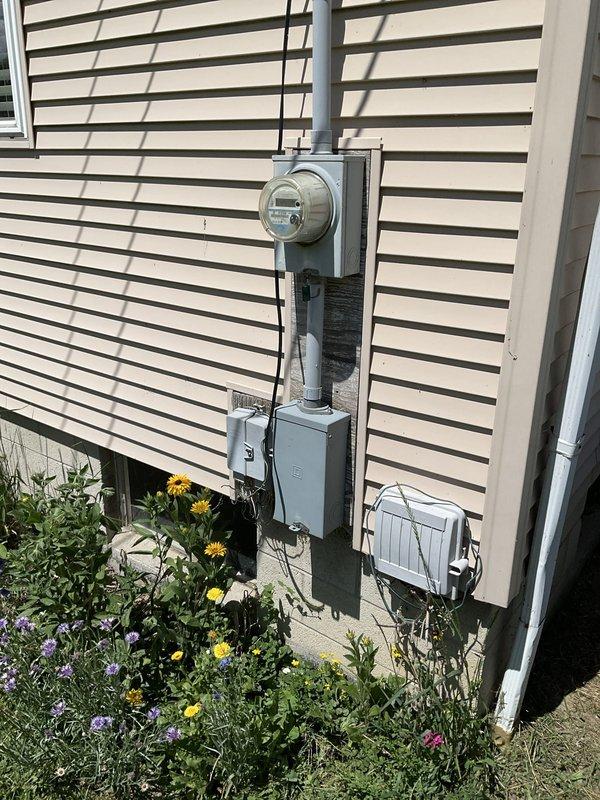 Provided replacement estimate for non-operational air conditioning system and existing Carrier WeatherMaker 9200 furnace located in basement utility area. Assessed current HVAC equipment configuration, electrical service capacity at exterior meter panel, outdoor condensing unit placement, and ductwork connections to determine appropriate replacement options and installation requirements.