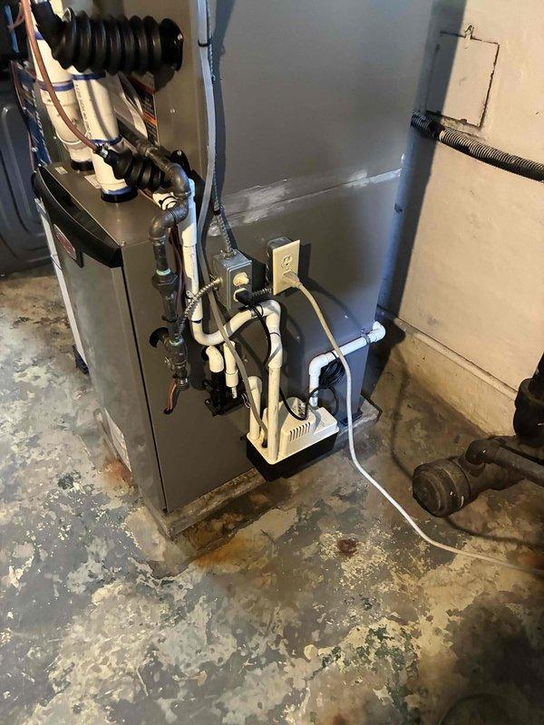 Successfully completed installation of a 2.5-ton air conditioning system with matching evaporator coil in rear-discharge configuration. The new AC unit was professionally connected to the existing furnace system, with all refrigerant lines, electrical connections, condensate drainage, and ductwork properly installed and secured. System was tested and verified operational, with all components functioning within manufacturer specifications.