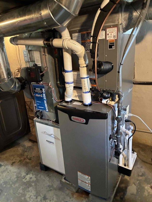 Successfully completed installation of a 2.5-ton air conditioning system with matching evaporator coil in rear-discharge configuration. The new AC unit was professionally connected to the existing furnace system, with all refrigerant lines, electrical connections, condensate drainage, and ductwork properly installed and secured. System was tested and verified operational, with all components functioning within manufacturer specifications.