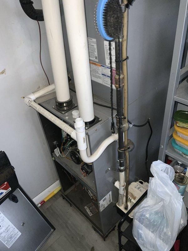 # HVAC Service Call - No Cooling Issue

Responded to service call for non-operational air conditioning system and thermostat. Upon arrival, discovered condensate drain line obstruction preventing system operation due to safety float switch activation. Cleared blockage from condensate drain line, verified proper drainage flow, and tested system operation. Unit restored to normal cooling function with thermostat responding appropriately to temperature settings.