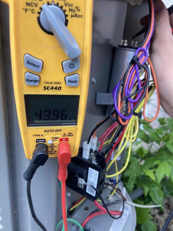 Completed preventive maintenance agreement visit on dual-system air conditioning setup. Performed electrical diagnostics on both units using digital multimeter to verify amperage draw and voltage readings on compressor circuits. Measured operating amperage at 7.29A and conducted voltage tests showing 0.0V on one circuit, along with additional readings of 43.96 on control voltage circuits. Inspected and tested HVAC control panel wiring connections, including relay components and multi-conductor control wiring. All electrical connections were verified for proper operation and system functionality was confirmed upon completion of maintenance procedures.