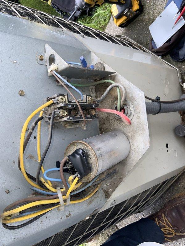 Responded to no cooling complaint on 10-year-old AC system. Upon arrival, performed diagnostic evaluation of outdoor condensing unit and electrical components. Removed service panel to inspect contactor, capacitor, and associated wiring connections. Verified power supply at exterior disconnect box and checked electrical connections for proper voltage and continuity. Inspected capacitor for signs of failure or degradation and tested contactor operation. Evaluated overall condition of aging unit including compressor functionality and refrigerant system integrity. Documented findings with photos of electrical components and disconnect box for service records. System required attention due to age-related wear on electrical components common in units exceeding 10-year service life.