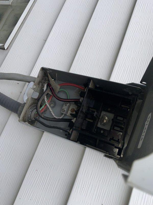 Responded to no cooling complaint on 10-year-old AC system. Upon arrival, performed diagnostic evaluation of outdoor condensing unit and electrical components. Removed service panel to inspect contactor, capacitor, and associated wiring connections. Verified power supply at exterior disconnect box and checked electrical connections for proper voltage and continuity. Inspected capacitor for signs of failure or degradation and tested contactor operation. Evaluated overall condition of aging unit including compressor functionality and refrigerant system integrity. Documented findings with photos of electrical components and disconnect box for service records. System required attention due to age-related wear on electrical components common in units exceeding 10-year service life.