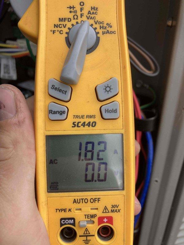Completed routine preventive maintenance inspection on residential air conditioning system as part of Club AC12-4 agreement. Performed comprehensive system evaluation including electrical testing with digital multimeter, recording voltage readings of 182V AC to verify proper power supply to the condenser unit. Inspected exterior equipment installation including beige horizontal-discharge condenser unit positioned on concrete pad alongside backup generator, confirming proper clearances and secure mounting. Verified electrical disconnect box functionality and examined conduit connections. Documented equipment condition through photographic records showing clean installation with adequate drainage and no visible refrigerant leaks or component damage. System operating within normal parameters with no immediate service needs identified.