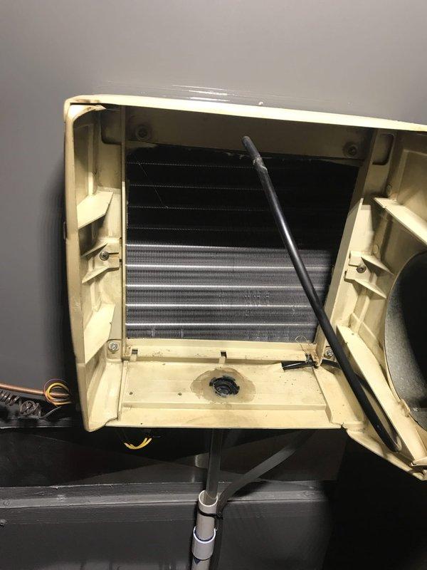Completed preventative maintenance service on wall-mounted air conditioning unit under Club AC8-12 agreement. Performed thorough cleaning of evaporator coil using vacuum equipment, inspected heat exchanger fins for proper condition, and verified drainage system functionality. All components found in good working order with unit operating within normal parameters.