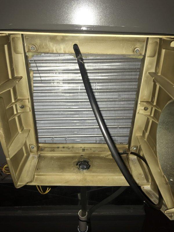 Completed preventative maintenance service on wall-mounted air conditioning unit under Club AC8-12 agreement. Performed thorough cleaning of evaporator coil using vacuum equipment, inspected heat exchanger fins for proper condition, and verified drainage system functionality. All components found in good working order with unit operating within normal parameters.