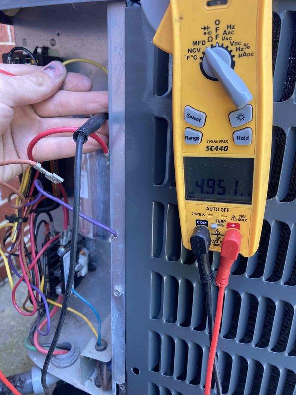 Completed routine maintenance inspection under Club AC12-4 agreement. Upon arrival, performed electrical diagnostics on the indoor air handler unit using digital multimeter, measuring voltage at control board terminals which read 485.1 volts. During inspection, discovered significant ice buildup on refrigerant lines and evaporator coil. The heavy frost accumulation covering the suction line and coil surfaces indicates a system malfunction, likely caused by restricted airflow, low refrigerant charge, or faulty metering device. Documented conditions with photos showing the extent of ice formation on the copper tubing and unit components. This freeze-up condition requires immediate attention as continued operation could damage the compressor and reduce system efficiency.