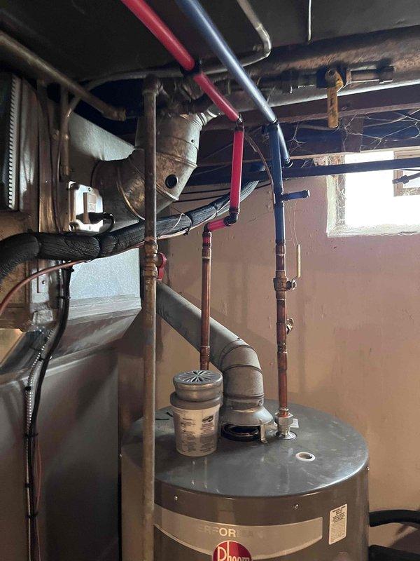 Responded to callback for air conditioning system not turning on with thermostat set at 70°F and house temperature at 72°F with no airflow from vents. Upon arrival, inspected HVAC system installation in utility room including furnace unit, condensate pump, and associated piping. Verified all equipment connections, electrical supply, and thermostat wiring. System operational after troubleshooting and resolving issue preventing AC compressor engagement.
