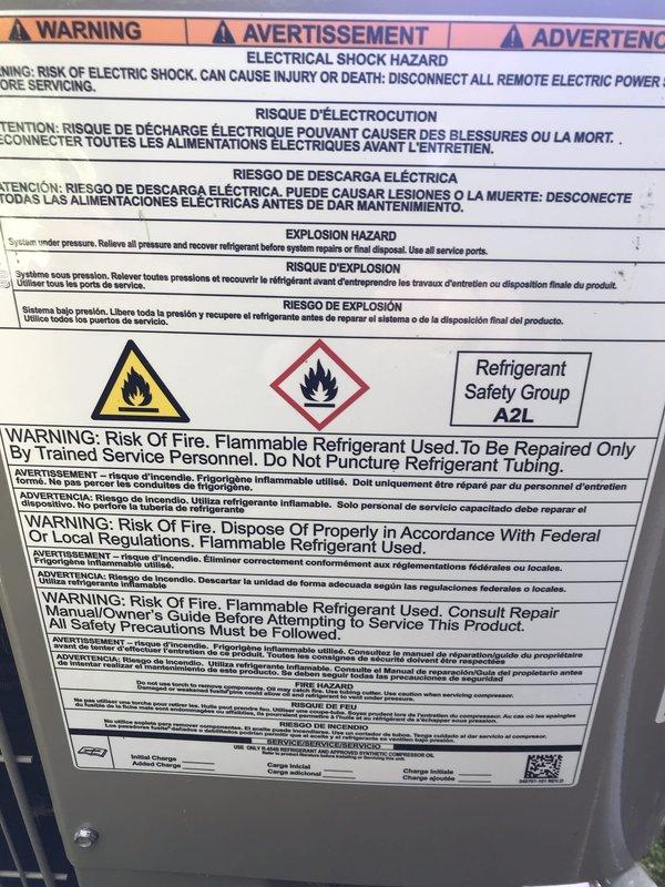 Responded to no cooling complaint on residential HVAC system. Upon arrival, inspected control board and wiring connections as customer suspected control board failure. Documented system information including A2L refrigerant safety classification label and control board terminal connections. Verified multiple wire terminations at control board including power, thermostat, and component connections. All wiring appeared properly secured to terminal block with appropriate color coding for circuit identification.