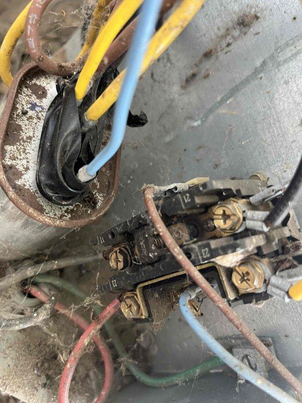 Completed scheduled HVAC maintenance agreement visit performing comprehensive tune-up on air conditioning and heating system. Inspected electrical connections at outdoor unit, noting significant dust, debris, and cobweb accumulation on terminal blocks and junction points with visible corrosion on metal components requiring monitoring for future service needs. All electrical connections verified secure, system operational upon completion.