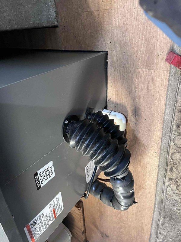 Responded to callback for reported coil leak on HVAC system. Upon inspection, located leak at evaporator coil connection point. Sealed leak area and reinstalled foam tape insulation on lineset. Secured all insulation with black zip ties to prevent future displacement. Documented installation with photos of indoor air handler unit and outdoor condenser connections. System tested and operating properly with no further refrigerant leaks detected.