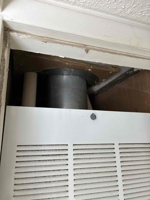 Performed comprehensive assessment of non-functional residential air conditioning system. Evaluated aging outdoor condenser unit showing significant weathering, rust, and corrosion on exterior surfaces, indicating end of serviceable life. Inspected interior components including air return grille and ductwork connections within wall cavity. Documented equipment condition through photography and provided replacement estimate for complete AC system upgrade to restore cooling functionality.