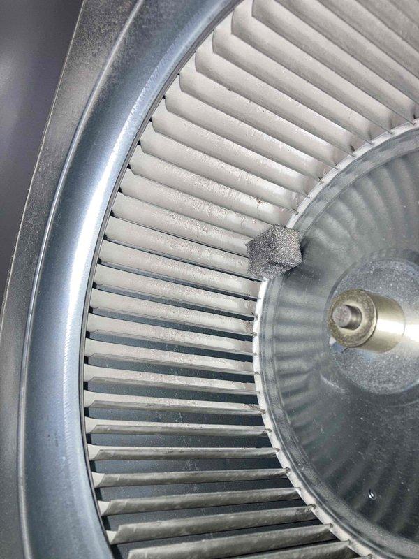 Completed scheduled HVAC maintenance agreement visit and performed comprehensive air conditioning tune-up service. Conducted electrical diagnostics using digital multimeter, measuring voltage and amperage readings on system components including capacitor circuits to verify proper operation. Inspected blower wheel assembly and documented significant dust and debris accumulation on fan blades and housing. Cleaned blower wheel to restore optimal airflow efficiency and prevent reduced system performance. Verified all electrical connections, tested system operation, and confirmed unit returned to proper working condition following maintenance procedures.