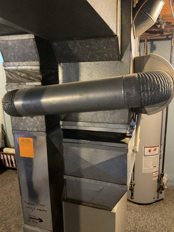 Performed estimate for furnace and air conditioning system replacement. Discovered AC disconnect box welded shut with melted wiring, rendering the unit unsafe for continued operation and not economically viable for repair. Documented existing HVAC infrastructure including ductwork, furnace installation, and water heater configuration for replacement planning purposes.