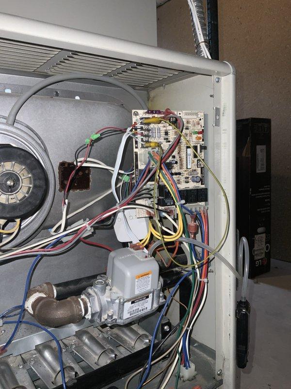 # No Cooling - 10-Year-Old AC System

Responded to service call for AC unit not operational since morning, affecting entire home. Customer reported this as an ongoing issue with the 10-year-old outdoor condensing unit.

## Diagnostic Findings

Upon arrival, performed comprehensive system evaluation of the split AC system. Accessed indoor air handler and inspected blower assembly, motor, and electrical connections. Blower wheel showed normal wear patterns consistent with 10-year operation. Motor shaft coupling and bearings appeared intact with no visible damage or excessive contamination.

Examined control board, wiring connections, and gas valve assembly in air handler cabinet. All wire terminations were secure with no signs of overheating or loose connections. Circuit board showed no visible damage, burned components, or blown fuses.

Proceeded to outdoor condensing unit for further diagnostics. Verified power supply to unit and checked disconnect. Inspected compressor, contactor, cap