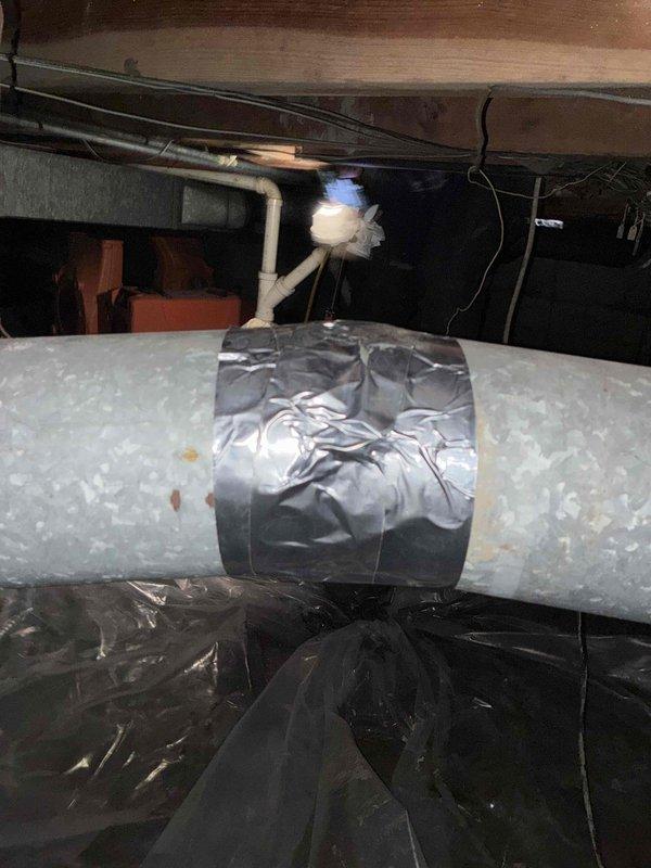 Installed new supply duct run in crawl space utilizing galvanized metal ductwork with proper elbow fittings to redirect airflow as needed. Insulated ductwork was secured and sealed with reflective foil tape at all seams and connections to ensure optimal system efficiency and prevent air leakage.