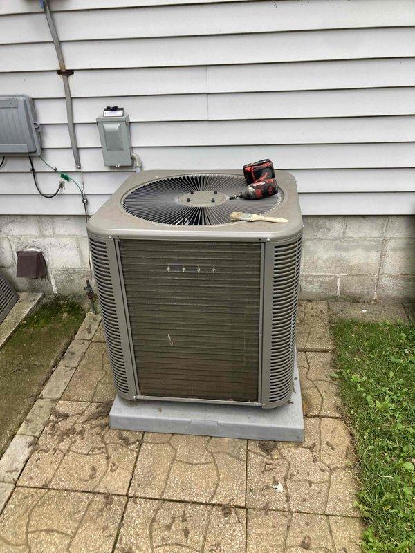 Completed scheduled preventative maintenance agreement visit on residential air conditioning system. Performed comprehensive inspection of outdoor condensing unit, noting accumulated dirt and debris on coil surfaces and louvers requiring attention. Cleaned condenser coils to restore optimal heat transfer efficiency and airflow. Verified proper operation of fan motor and compressor. Inspected electrical disconnect, conduit connections, and unit mounting on concrete pad. All components found operational following cleaning and inspection. System returned to normal service with improved cooling efficiency.
