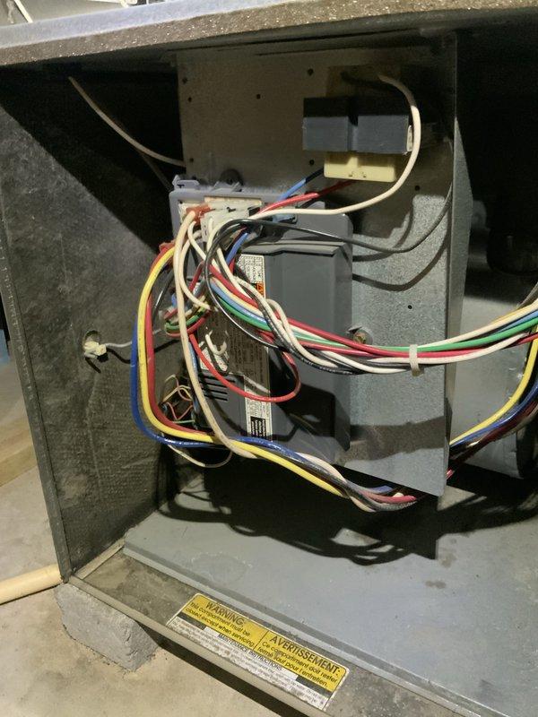 # AC Not Working 2-689

Responded to no cooling call on aging air conditioning system. Upon arrival, performed diagnostic evaluation of outdoor condensing unit and indoor air handler components. Inspection revealed failed dual run capacitor (35/5 MFD) on outdoor unit, which was preventing compressor and condenser fan motor from operating properly. Capacitor showed visible signs of deterioration and tested outside acceptable microfarad range.

Replaced defective dual run capacitor with new OEM-equivalent component rated at 35/5 MFD. Verified all electrical connections at outdoor disconnect and contactor were secure and properly torqued. Inspected indoor air handler electrical components, control board, and transformer for any secondary issues. All indoor components tested within normal operating parameters.

Restored power to system and monitored startup sequence. Compressor and outdoor fan motor engaged properly. Verified system achieved appropriate temperature split across evaporator 