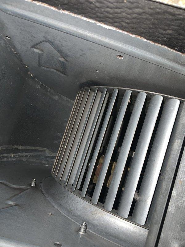 Completed routine maintenance tune-up on 10-year-old furnace and air conditioning system. Inspected heat exchanger and noted heat stress discoloration patterns on metal surfaces, indicating normal operational wear consistent with system age. Checked blower assembly, intake grille, and ventilation components; cleaned accumulated dust and debris from air handler unit to ensure proper airflow and system efficiency.