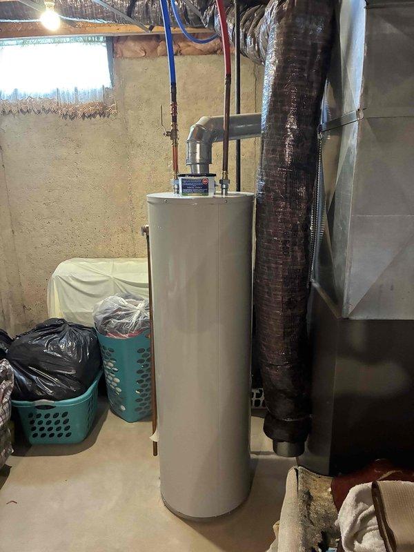 Conducted estimate for air conditioning replacement at property with 21-year-old natural gas furnace currently non-operational. Assessed basement mechanical room containing existing HVAC equipment, ductwork configuration, and utility connections including water heater proximity to determine replacement specifications. Documented existing system layout, available clearances, and installation requirements for complete AC system replacement proposal.