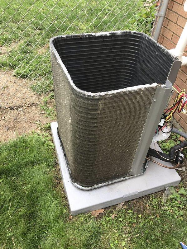 Completed AC Club preventive maintenance agreement visit on outdoor condensing unit. Performed comprehensive system inspection including electrical testing with digital multimeter to verify proper voltage and capacitance readings, visual assessment of condenser coil condition noting exterior weathering and biological growth on lower fins, and verification of refrigerant line connections and unit mounting stability on concrete pad.