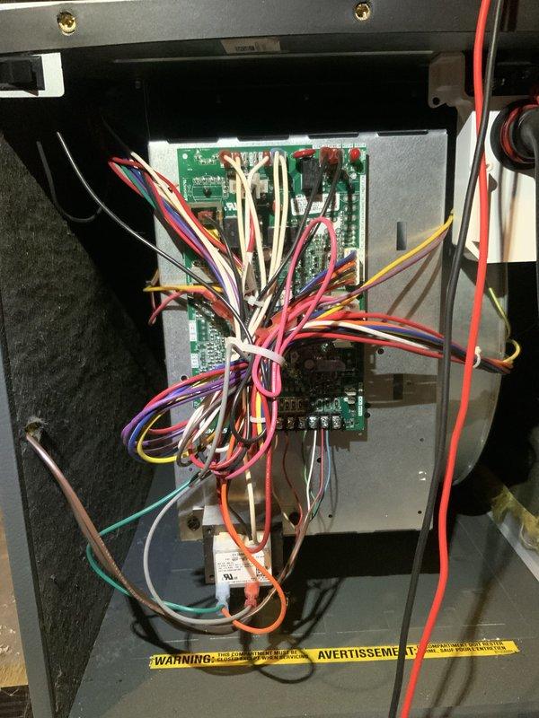 Completed preventive maintenance tune-up on split system with 2-year-old air conditioning unit and 30-40 year old furnace. Performed comprehensive inspection of furnace control board assembly, verified proper wire connections and electronic components functioning correctly, and documented control module and high-pressure switch assembly for service records. All systems tested and operating within normal parameters.
