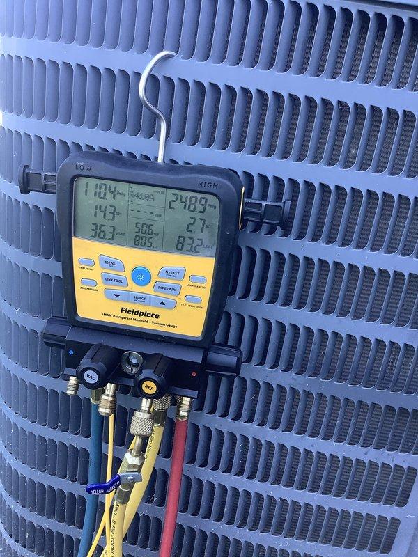 # HVAC Service Report

Responded to emergency no-cooling call for five-year-old air conditioning system. Upon arrival, performed comprehensive diagnostic testing using digital manifold gauges to measure system pressures and temperatures across both indoor evaporator coil and outdoor condensing unit. Readings indicated abnormal operating conditions requiring immediate attention.

Inspected indoor air handler unit located in attic space, noting Weber-branded equipment with proper drainage system and condensate management in place. Verified unit accessibility and examined all visible components for signs of failure or malfunction. Connected diagnostic equipment to service ports on outdoor condenser unit to obtain live refrigerant pressure and temperature data.

Digital manifold readings revealed system operating parameters outside normal range, with pressure measurements indicating potential refrigerant charge issues or mechanical failure preventing proper heat transfer. Analyzed superhea