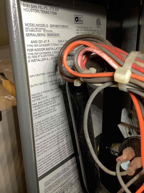 Completed preventive maintenance tune-up on Goodman GMHS0703BXAC furnace system, serial number 0908095381. Performed comprehensive inspection of unit interior, verified electrical wiring connections and routing through housing grommets, and documented manufacturer specifications and system configuration for service records.