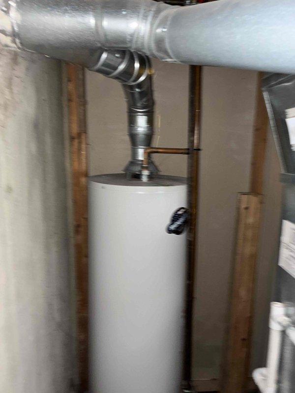 Conducted site evaluation for air conditioning system replacement at residential property. Assessed existing outdoor AC unit positioned on concrete pad adjacent to house, documented current equipment configuration including electrical connections and condensate drainage setup. Reviewed interior mechanical space containing water heater and ductwork to determine compatibility requirements for new system installation. Provided homeowner with equipment options and discussed available financing programs for complete AC replacement.